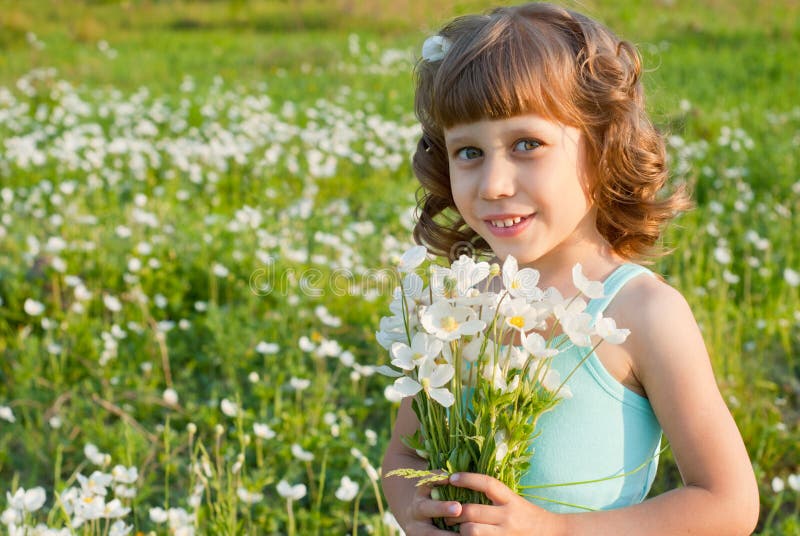 Girl with a bouquet of flowers royalty free stock photography