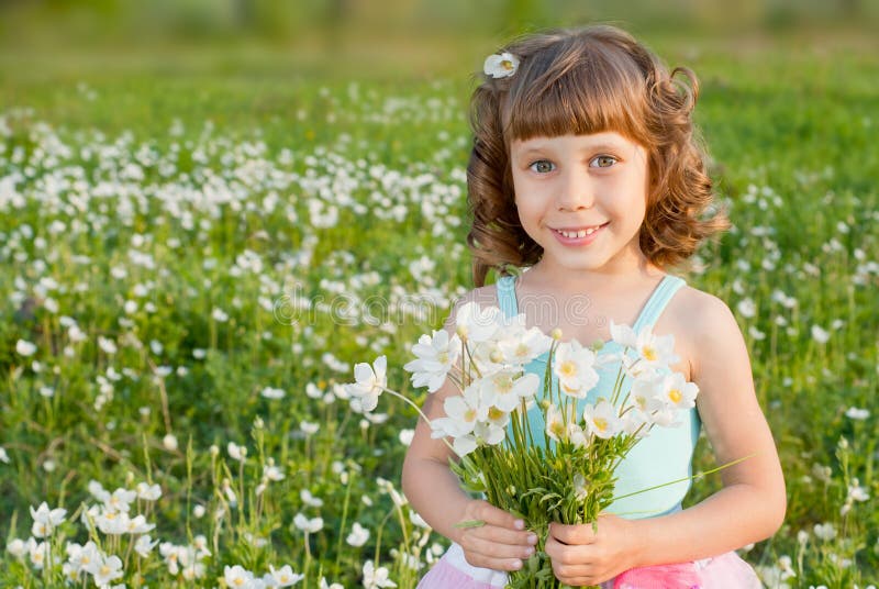 Girl with a bouquet of flowers royalty free stock photos