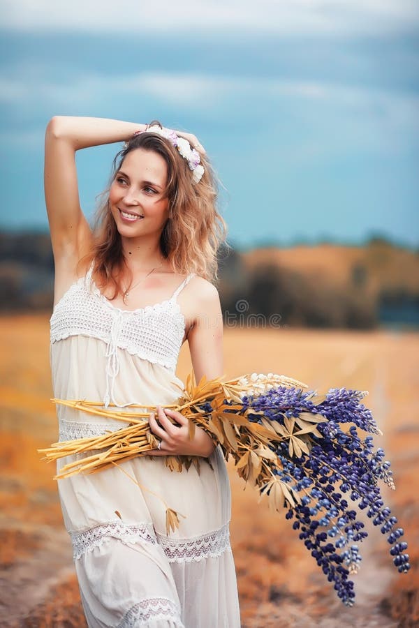 Girl With A Bouquet Of Dandelions Stock Photo - Image of background ...