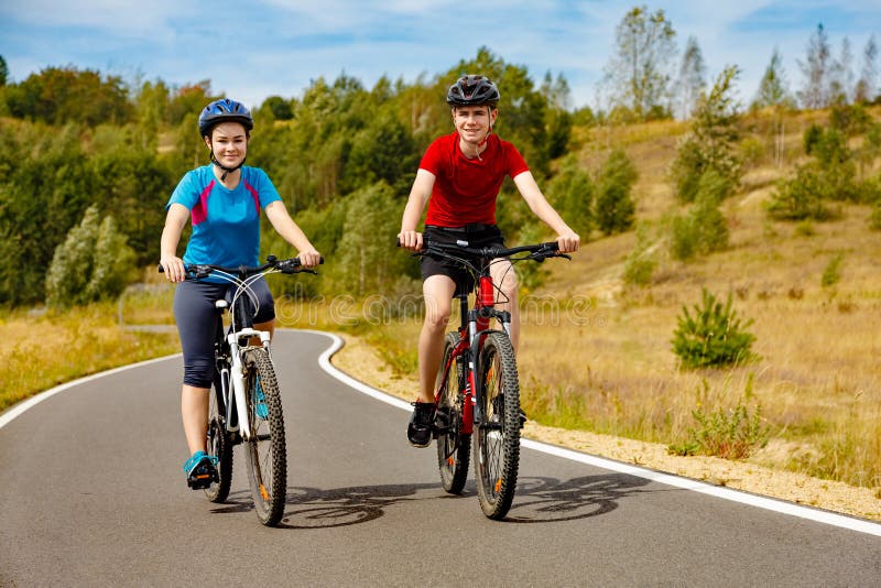 Girl and boy biking stock photo. Image of person, relaxation - 67973976