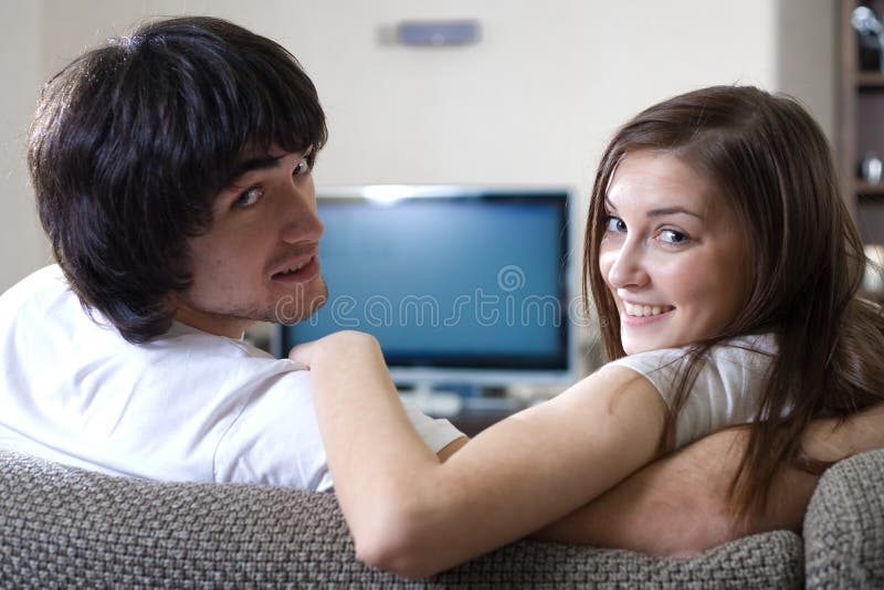 Girl and boy in front of TV