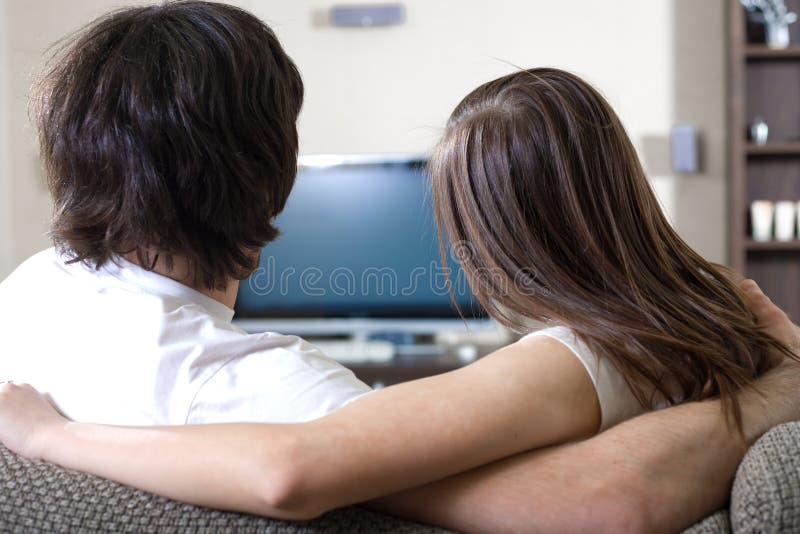 Girl with boy in front of TV