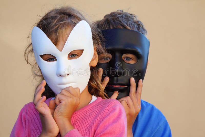 Girl and boy hide faces behind masks