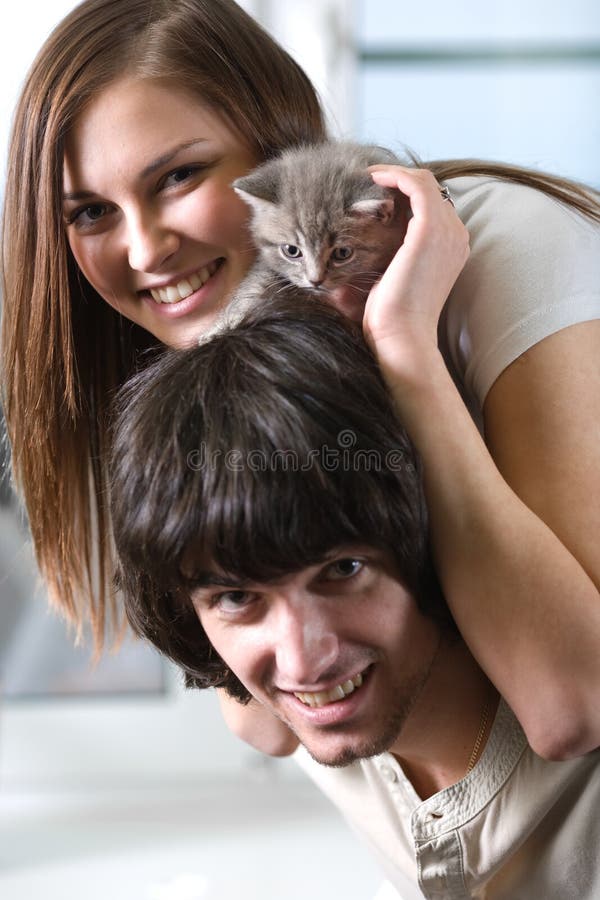 Girl with boy and kitten stock image. Image of eyes, animal 13943703