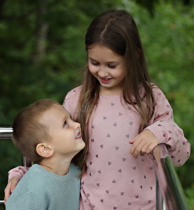 Girl and Boy Look at Each Other Stock Photo Image of cheerful, funny