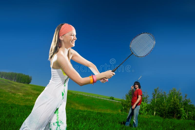 Girl and boy with rackets