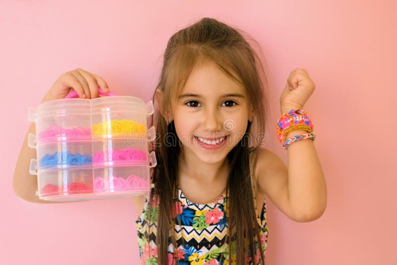 Girl With Braided Bracelets On Wrist Holes In Hand A Container With A Set Of Tools Stock Image