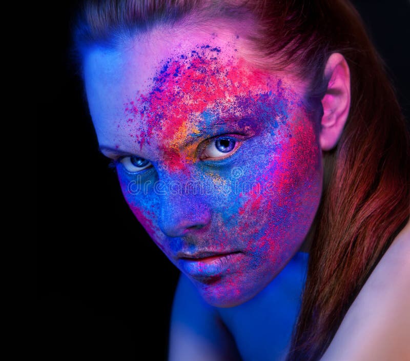 A girl with bright makeup unusual body painting
