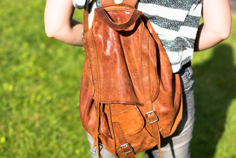 Girl with a brown backpack stock photo. Image of university 57233038