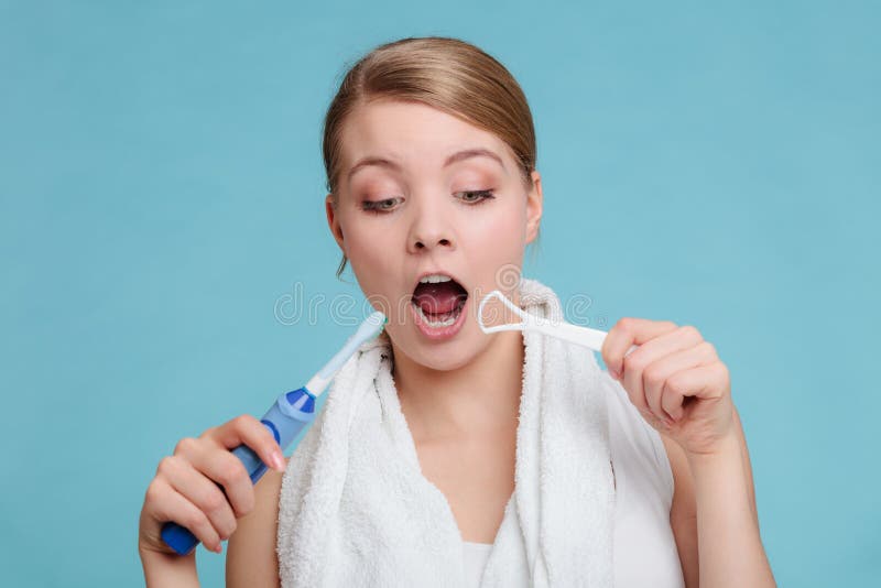 Girl with Brush and Tongue Cleaner photo