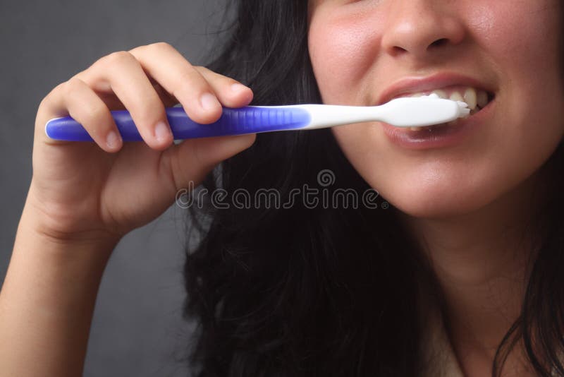 Girl brushing her teeth