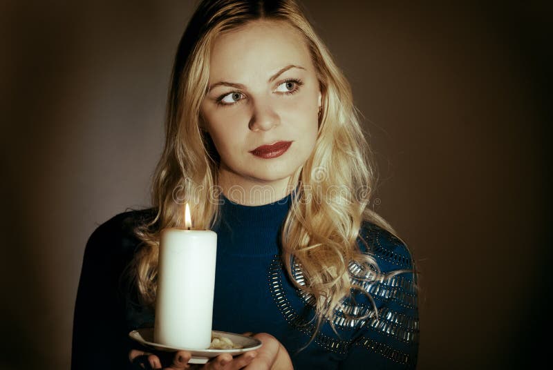Girl with a candle stock photo. Image of medium, light 22552796