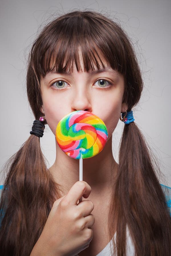 Girl with candy stock image. Image of girl, teen, attractive 46136419