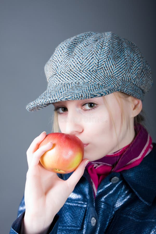 Girl in a cap royalty free stock images