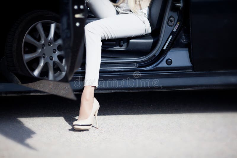 Female Leg In A High Heel Shoe At A Car Door Stock Image - Image of ...