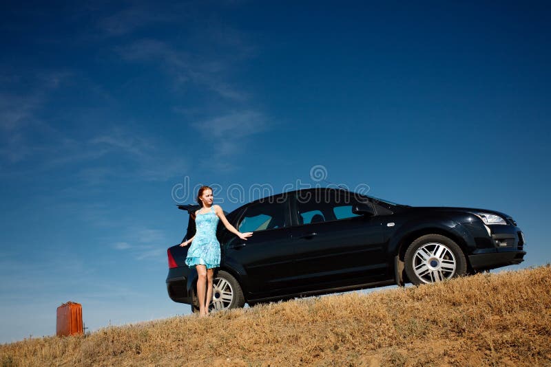 Girl by the car