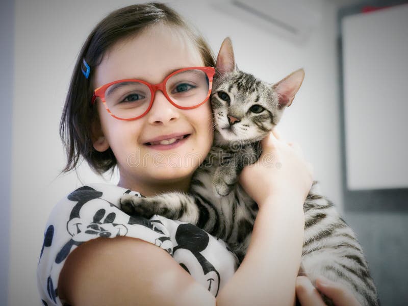 Girl with a cat in her arms stock image Girl with a cat in her arms stock image