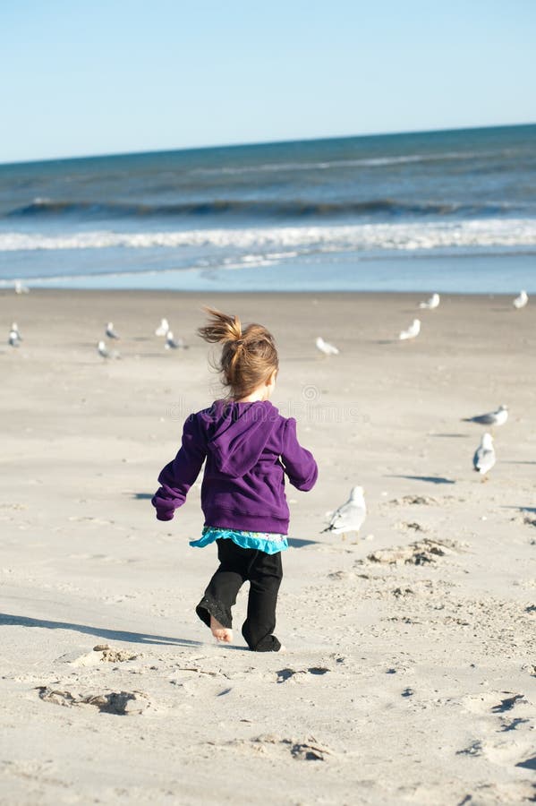 Girl chasing birds