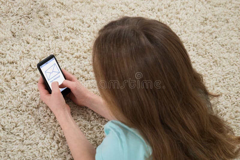 Girl Checking Message On Mobile Phone stock image Girl Checking Message On Mobile Phone stock image