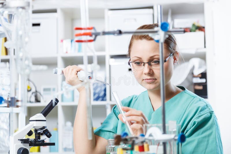 Girl in a chemistry lab royalty free stock image