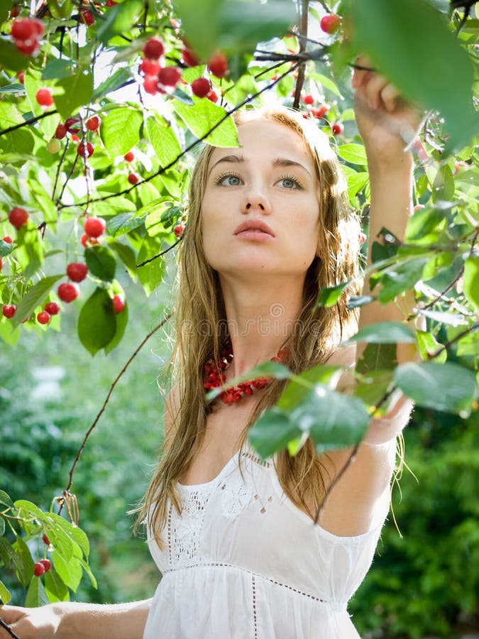 Girl with cherry stock image. Image of leaves, fruit 10158771