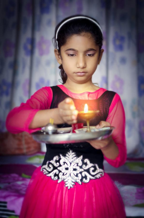 Girl child portrait holding prayer plate