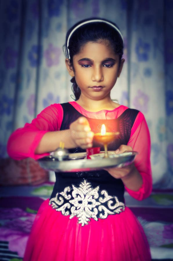 Girl child portrait holding prayer plate royalty free stock photo Girl child portrait holding prayer plate royalty free stock photo