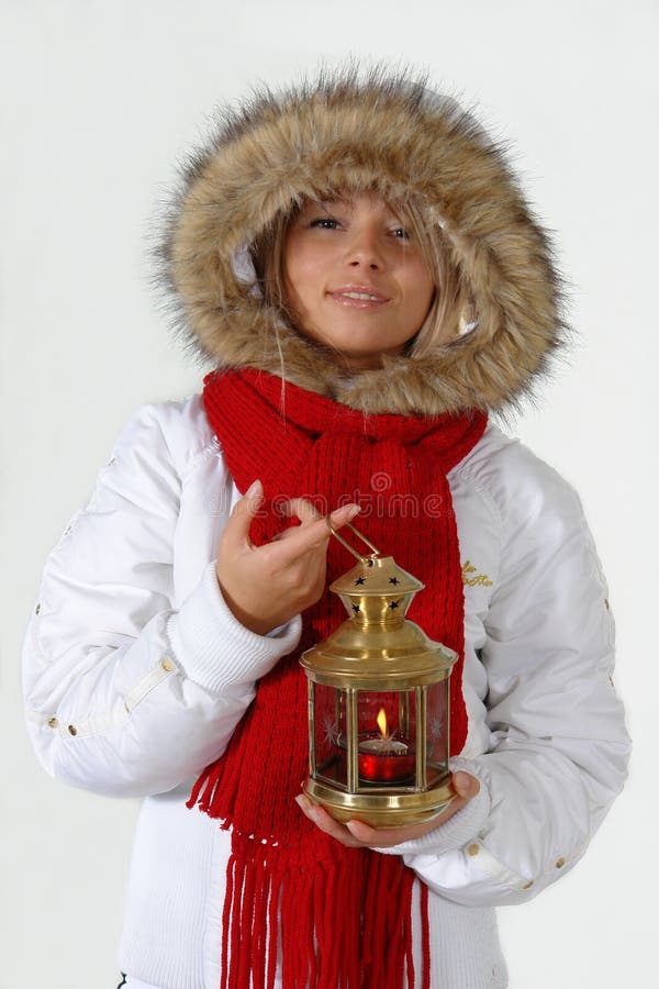 Girl with the christmas ball and lamp