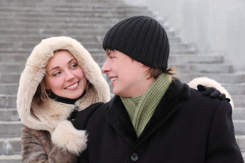 Girl in coat with hood and man smiling royalty free stock photos Girl in coat with hood and man smiling royalty free stock photos