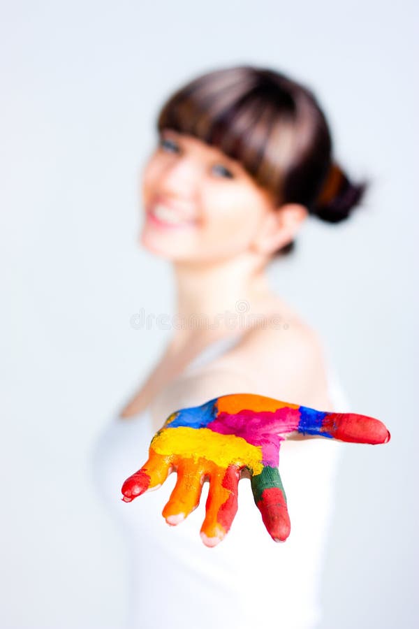 A girl with colored hands