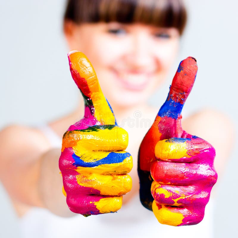 A girl with colored hands