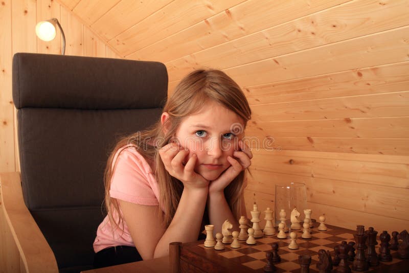 Young female concentrating hard of her next move at a chess game Stock  Photo - Alamy