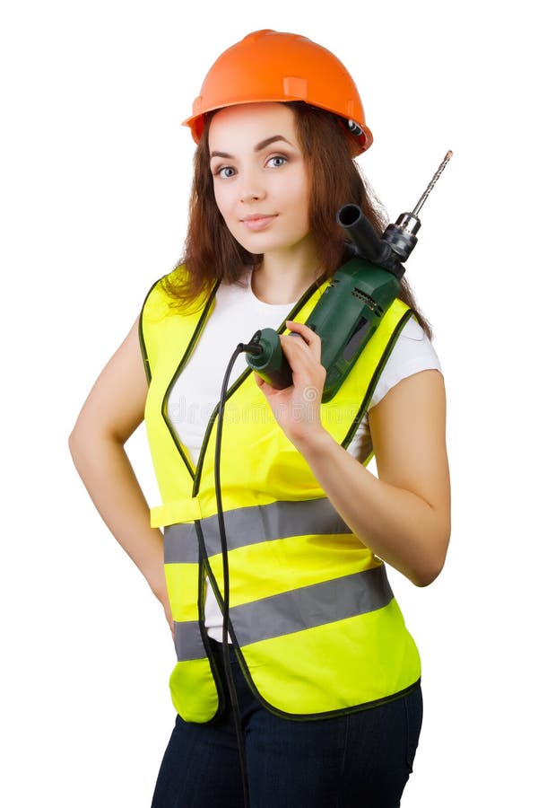 The girl in a construction vest and a helmet with an electric drill.