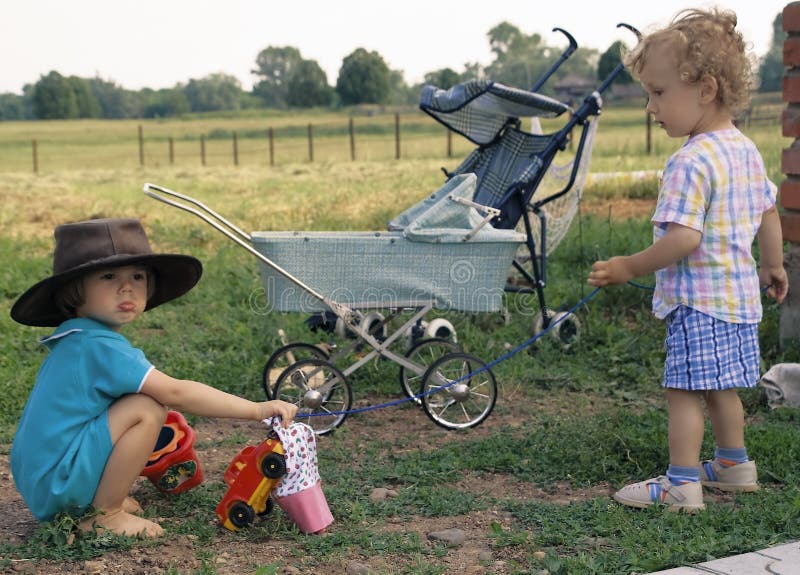 Girl in a cow-boy hat and curly boy (2)