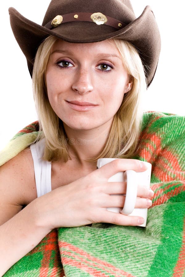 Girl in a cowboy hat with cup of tea