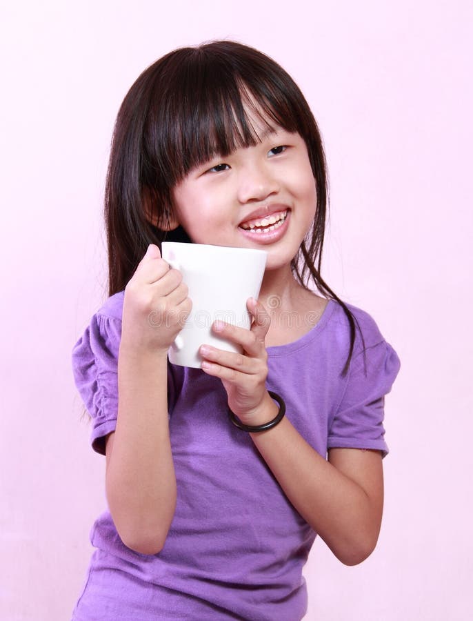 Girl and cup stock image. Image of child, chinese, holding 32879499