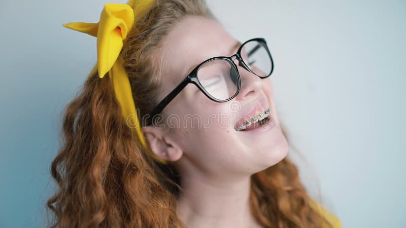 Portrait of young girl laughing towards the camera