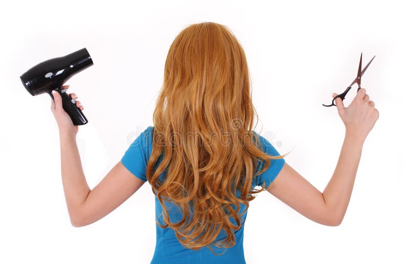 Girl with curly hair holding scissors and hair dryer isolated stock image Girl with curly hair holding scissors and hair dryer isolated stock image