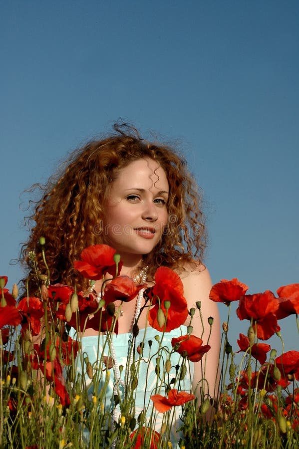 Girl With Curly Hair In Poppies Stock Photo - Image: 14680716