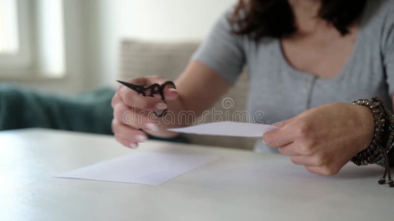 Girl Cuts Office Paper With Scissors stock video footage