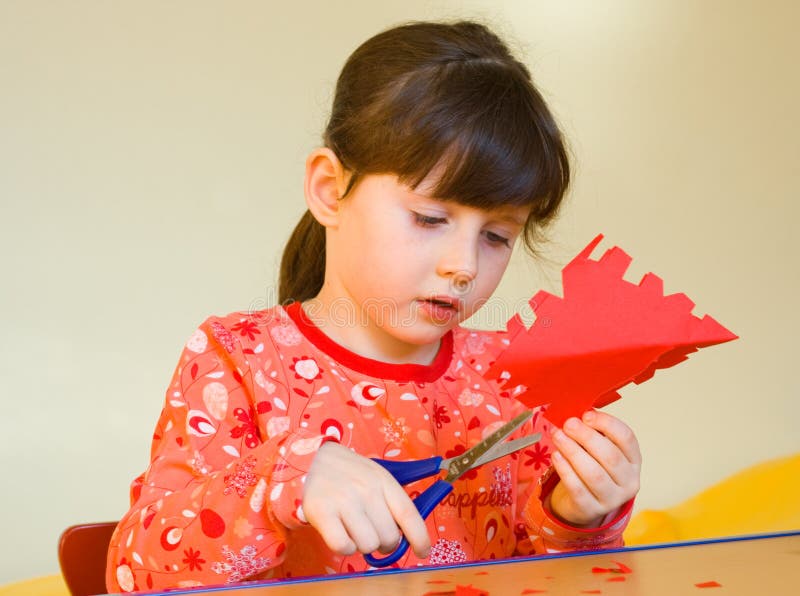 Girl cutting  paper  stock image Image of paper  childhood 