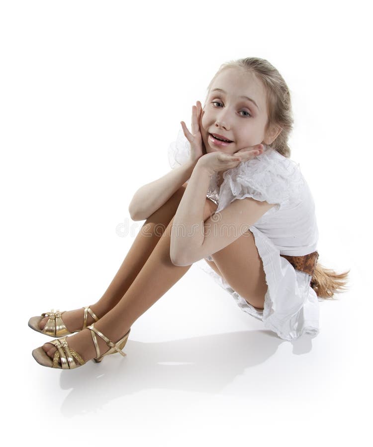 Girl dancer sitting on a floor