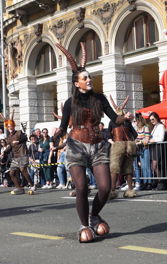 Girl dancing on the street masked in the god Pan on the carnival celebration day stock image Girl dancing on the street masked in the god Pan on the carnival celebration day stock image