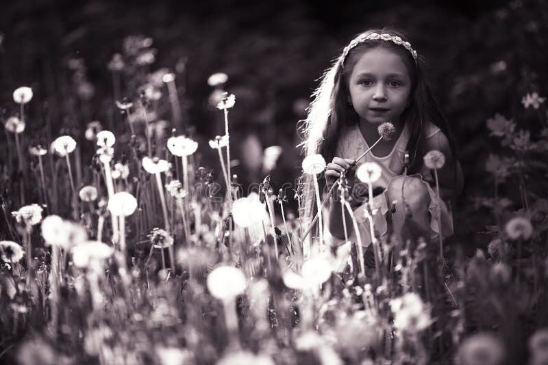 Girl in dandelion field