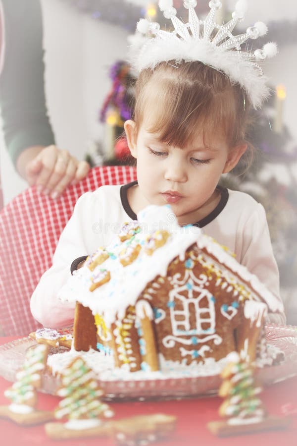 Girl Decorates Gingerbread House Stock Image - Image of kitchen, girl ...