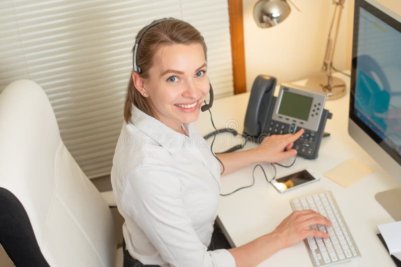 Girl dispatcher works with the phone. In the call center royalty free stock photos Girl dispatcher works with the phone. In the call center royalty free stock photos