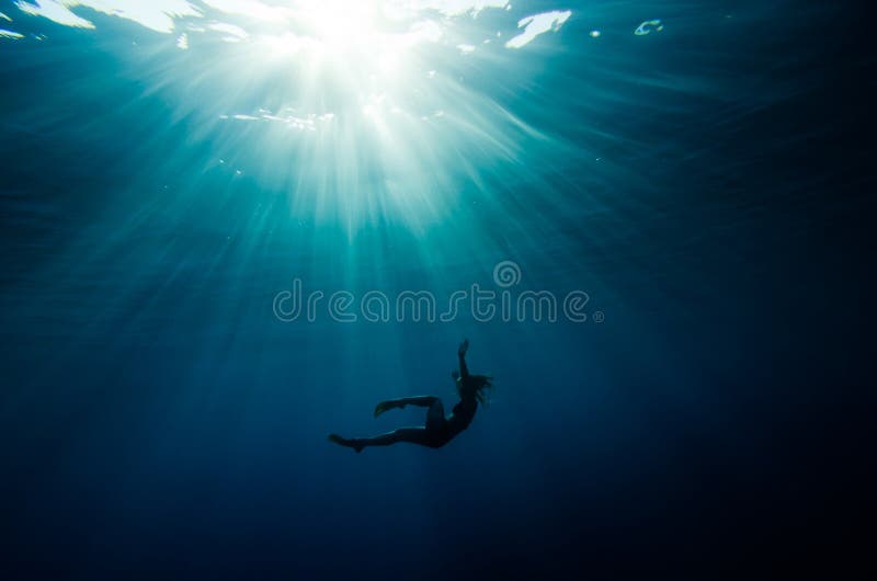 Girl dive underwater