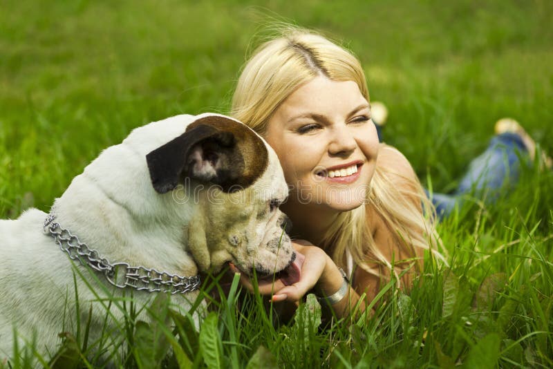 Girl with dog in grass