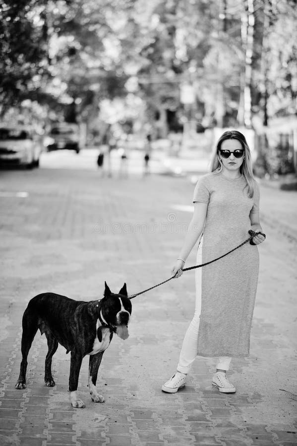 Girl with Dog Pit Bull Terrier on a Walk. Stock Photo - Image of walk ...