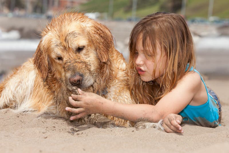 Girl with dogs at the beach